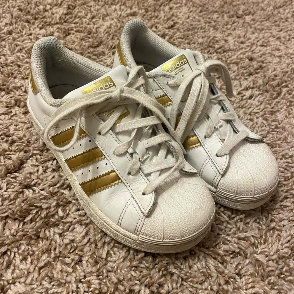 Girls size 12 gold stripe Adidas Superstars